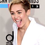 Pic of Miley Cyrus no bra under white jacket at AMA 2013