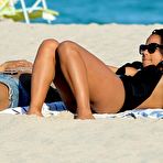 Pic of Christina Milian sunbathing in black swimsuit