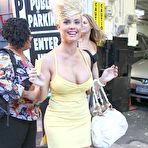 Pic of Busty Nicole Austin shows deep cleavage in short yellow dress