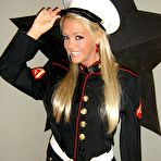 Pic of Foxy Jacky in a marine outfit plays with a dildo
