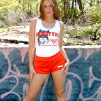 Pic of Ann Angel - Ann Angel takes her tight orange shorts off and fingers her hungry wet meat hole