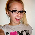 Pic of Amateur blonde girl with glasses does some nude mirror shots.