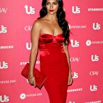 Pic of Camila Alves posing for paparazzi in red dress at US Weekly Hot Hollywood Party