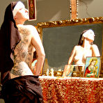 Pic of Kinky Tattoo Nun blowing a big cock priest