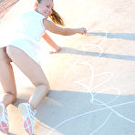 Pic of Petite angel Josie graffitiing the basketball court without panties under tennis skirts