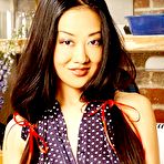 Pic of Asian XXX Models : Tiger Lily : Strips in the kitchen