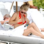Pic of Jenny McCarthy cleavage in red bikini on Miami Beach