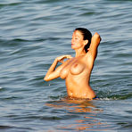 Pic of Busty Rebecca Loos caught topless on the beach