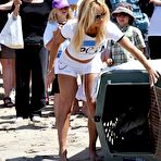 Pic of Pamela Anderson in shorts and tanktop supporting PETA at Malibu Beach