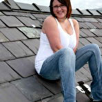 Pic of Twenty year old chubby brunette student poses on the roof