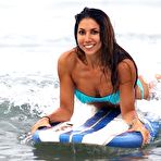 Pic of Leilani Dowding paddleboarding in blue bikini