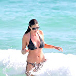 Pic of Lisa Snowdon in various bikinies on the beach