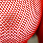 Pic of Ginger FTV - Ginger FTV takes her sexy red fishnet top and shows us her bouncy round jugs.