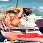 Pic of Emma Rigby sunbathing in red bikini