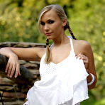 Pic of Lizzy Merova - Lizzy Merova takes her sexy white dress outdoors and shows us her beautiful rack.