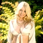 Pic of Sandy Summers - Blonde angel, Sandy Summers sits in the shade and slowly takes off her clothes.