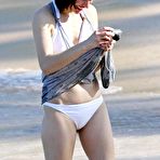 Pic of Milla Jovovich on the beach in white bikini