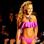 Pic of Busty Adrienne Bailon in yellow and pink bikinies runway shots