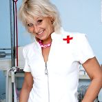 Pic of Pervy midle aged nurse Romana masturbates her pussy with pussy spreader on gyno chair