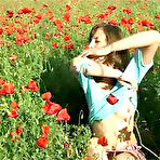 Pic of Skinny and tiny tits teen rubs pussy in flowers