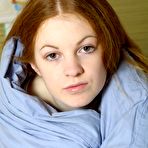 Pic of ATK galleria presents: Nicole, fair skinned redhead stripping in her bed.