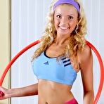 Pic of Frisky blondie bares boobies before hula hoop and skipping rope training in her patterned pink pantyhose