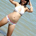 Pic of Cute little Thai amateur Febe poses at the beach and flashes