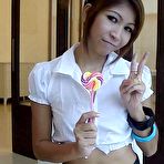 Pic of Sexy schoolgirl Thai baby named O sucks a lolipop and shows off her bald pussy