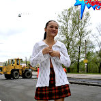 Pic of Schoolgirl lifts her checkered skirt in public