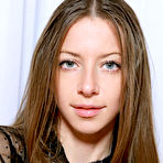 Pic of Blue-eyed darling Mika A with long brown hair, long and slender physique, and perky assets