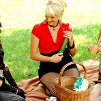 Pic of Kitty Saliery and two more clothed ladies have lesbian sex and pissing fun on picnic