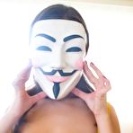 Pic of Masked brunette babe Alina Henessy spreads her asshole after throwing her panties off.
