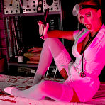 Pic of Kinky MILF nurse in white stockings over pantyhose @ PantyhoseAddict