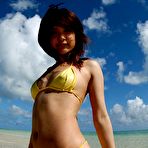 Pic of Hot Asian girl in a yellow string bikini takes it all off while walking in the clear water and showing off her hairy patch.