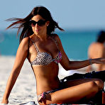 Pic of Claudia Romani shows cleavage in leopard bikini on the beach