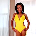 Pic of Horny ebony doll Lauren Lesley in the yellow swimsuit and absolutely nude