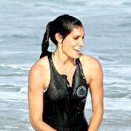 Pic of Daniela Ruah surfing on the beach