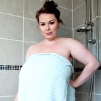 Pic of Busty Gina G. soaps up her tits in the shower