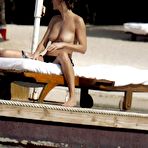 Pic of Karen Mulder relaxing topless on the beach