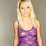 Pic of Cute blonde darling Pinky June is ready to take off that purple top and show her tits.
