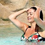 Pic of Busty Casey Batchelor sunbathing in bikini in a pool