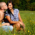 Pic of Euro teen couple fucks sensually in a field of pretty yellow flowers