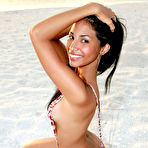 Pic of Black haired sweet latina Ruth Medina poses naked at the seaside in the sunset