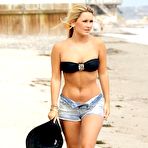 Pic of Sam Faiers in bikini top and shorts on the beach