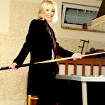 Pic of Blonde Mia Stone strips her male suit and poses in noting but tie by the pool table.