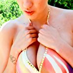 Pic of The bit titted bimbo Kelly Divine is playing with burning hot body outdoor