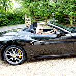 Pic of MILF Jan Burton flashes her stockings in a Ferrari