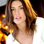 Pic of Beautiful brunette August Ames strips and poses on the floor - porn pics at My Pornstar Book