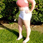 Pic of Smiling huge titted middle aged fattie Seana Rae in top and skirt poses outdoors
