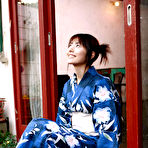 Pic of Momoko Tani Asian exposes sexy legs under geisha dress and smiles